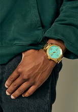 Load image into Gallery viewer, Nixon Corporal SS Gold / Turquoise / Gold New Style